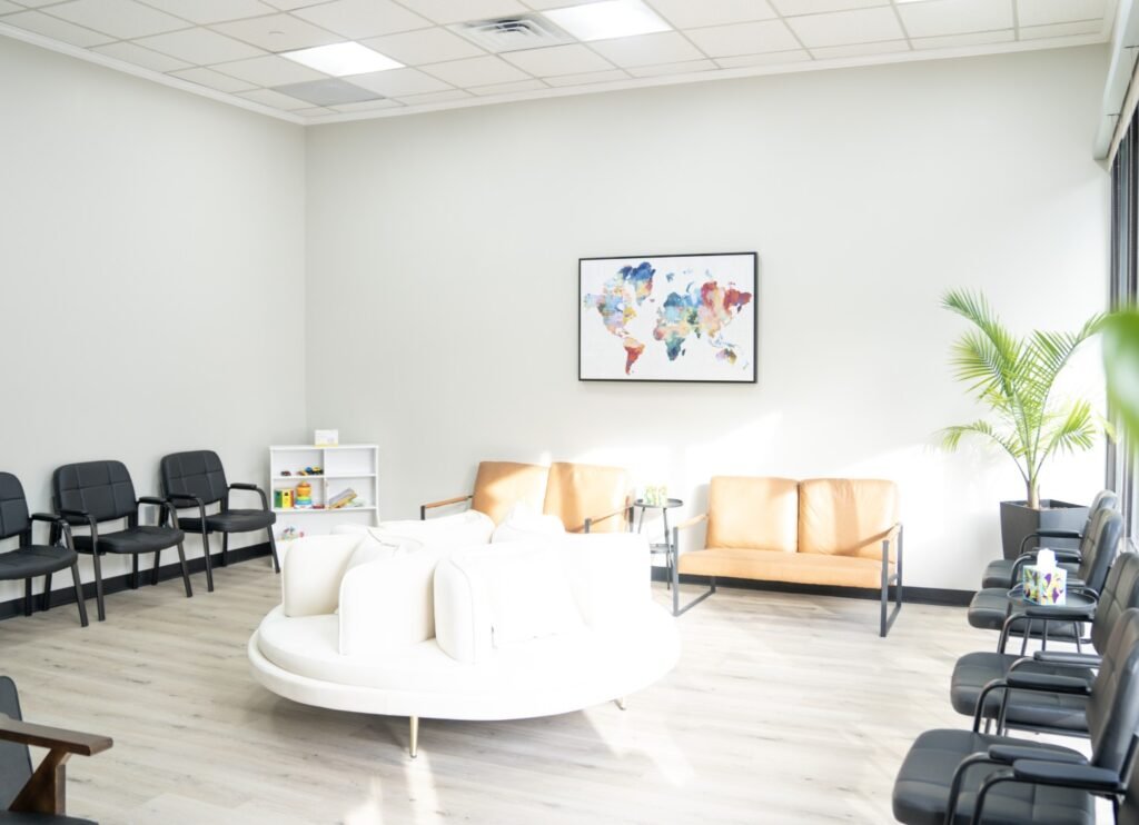 Bright and modern waiting room at VitalCare Express clinic with comfortable seating and natural light