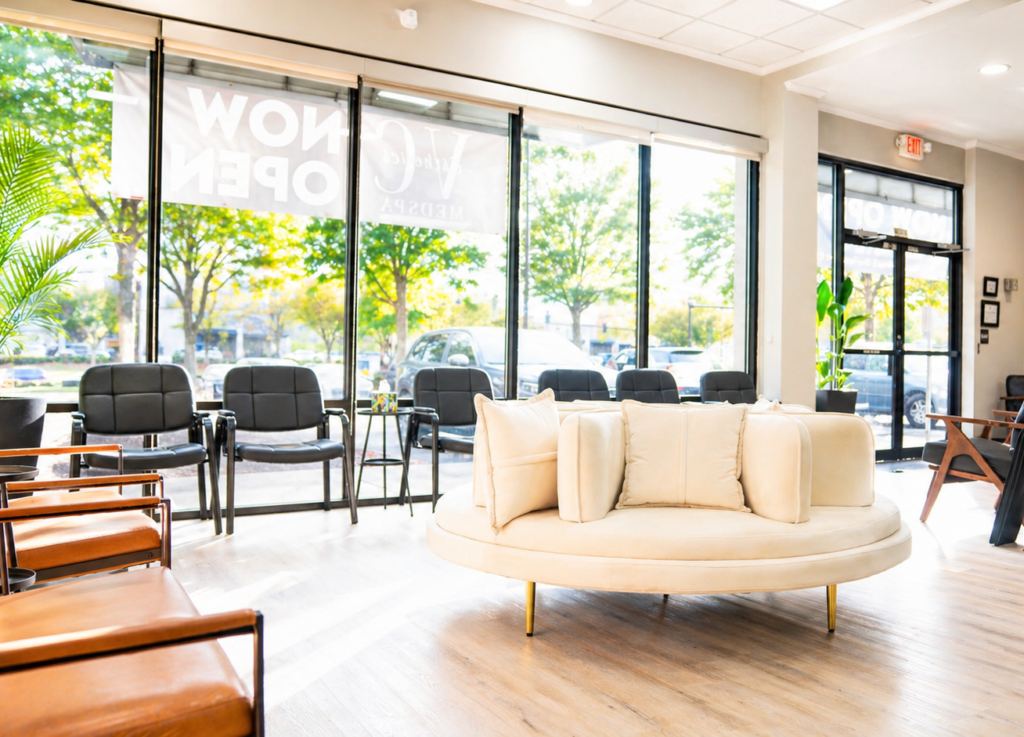 Spacious and sunlit waiting room at VitalCare Express clinic with modern seating and large windows